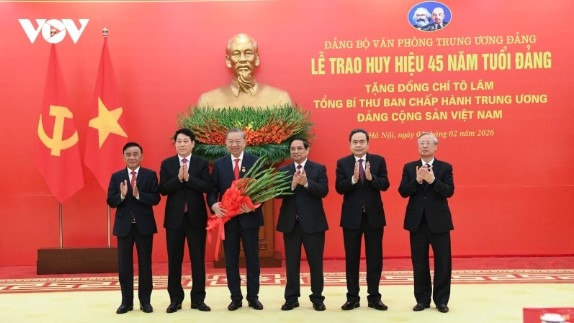 45-year Party membership badge presented to General Secretary To Lam